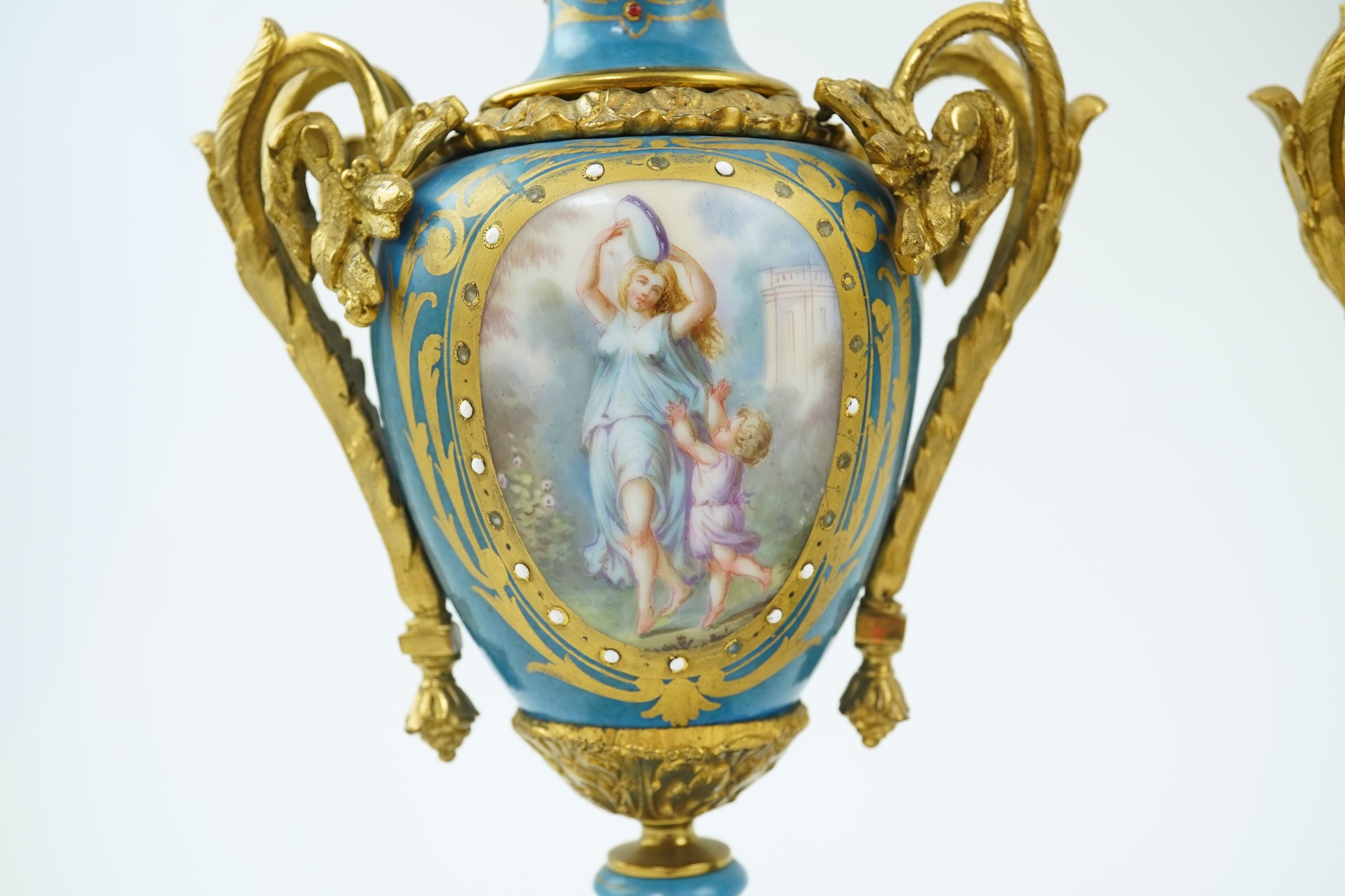 A pair of late 19th century ormolu mounted Sevres style porcelain cassolettes